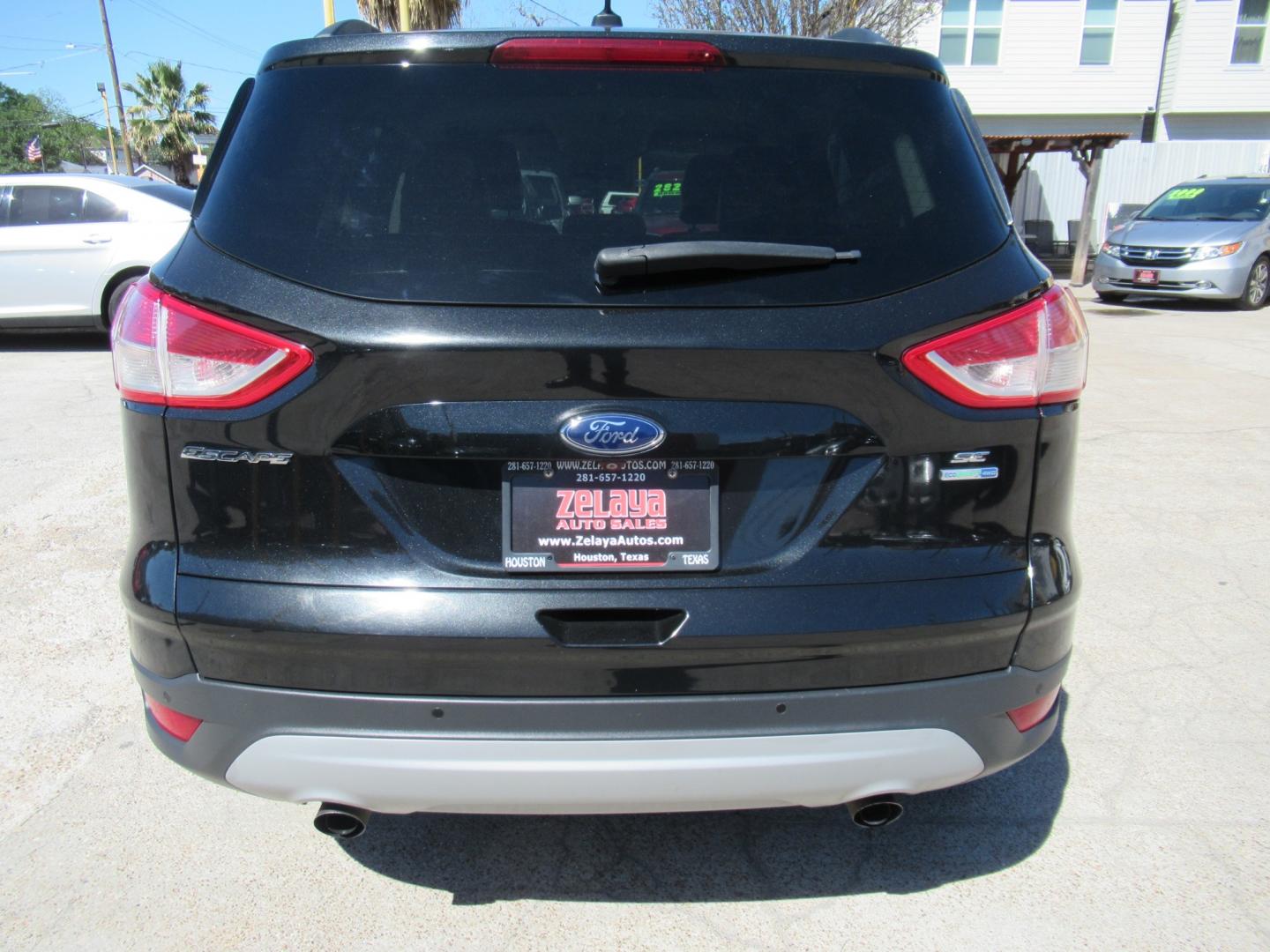 2014 Black /Black Ford Escape SE 4WD (1FMCU9GX5EU) with an 1.6L L4 DOHC 16V engine, Automatic transmission, located at 1511 North Shepherd Dr., Houston, TX, 77008, (281) 657-1221, 29.798361, -95.412560 - 2014 FORD ESCAPE SE VIN: 1FMCU9GX5EUC37295 1 F M C U 9 G X 5 E U C 3 7 2 9 5 4 DOOR WAGON/SPORT UTILITY 1.6L I4 F DOHC 16V GASOLINE FRONT WHEEL DRIVE W/ 4X4 - Photo#24